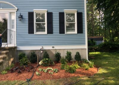 An excavator both dug out the old soil and laid the new soil. This north facing garden now has 19 shrubs and 30 perennials! Greenleaf’s Garden Design specializes in Garden Design, Maintenance, and Installation within 45 miles of Tyngsboro MA.