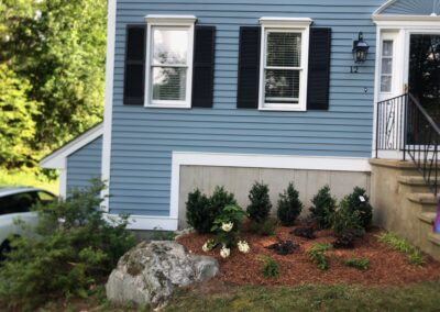 An excavator both dug out the old soil and laid the new soil. This north facing garden now has 19 shrubs and 30 perennials! Greenleaf’s Garden Design specializes in Garden Design, Maintenance, and Installation within 45 miles of Tyngsboro MA.