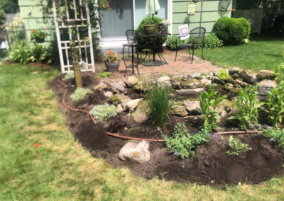 Summer’s here, and it’s the perfect time to give your perennial garden a glow-up! For this garden redesign project in Hudson, NH, we used the Excavator to dig out 10 yards of poor soil and replaced it with seven yards of good soil. Last year , in early July, we planted 100 perennials which were a mix of shade and sun loving. These new perennials really made the spot beautiful. Have questions about your garden redesign or need plant recommendations? Drop us a message or give us a call and let Greenleaf’s Garden Design get your garden blooming!