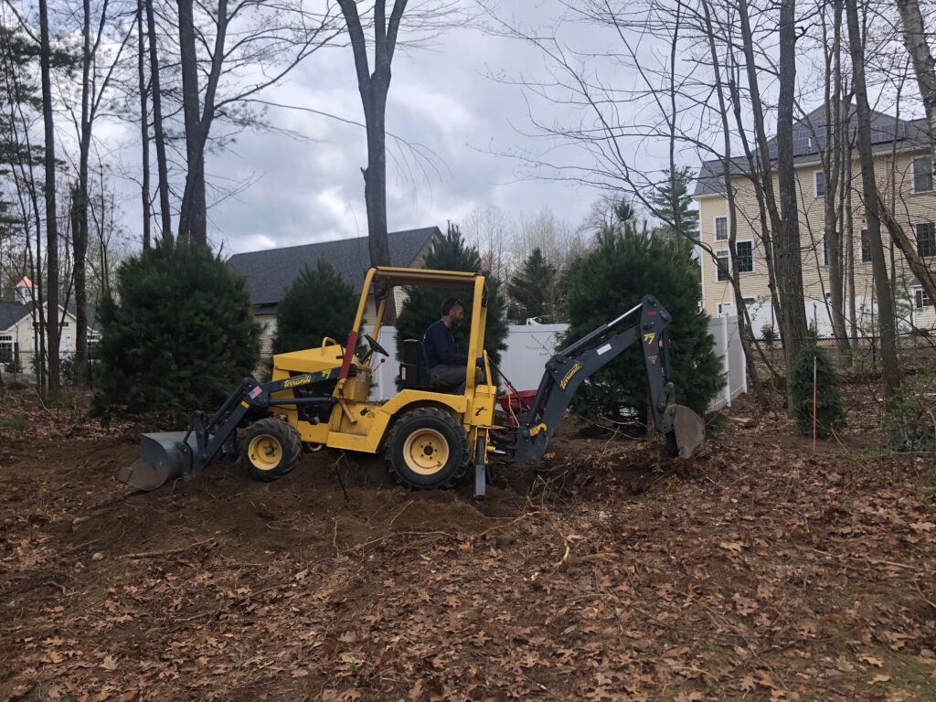 14 Trees Hollis picture #2 yellow tractor digging hole