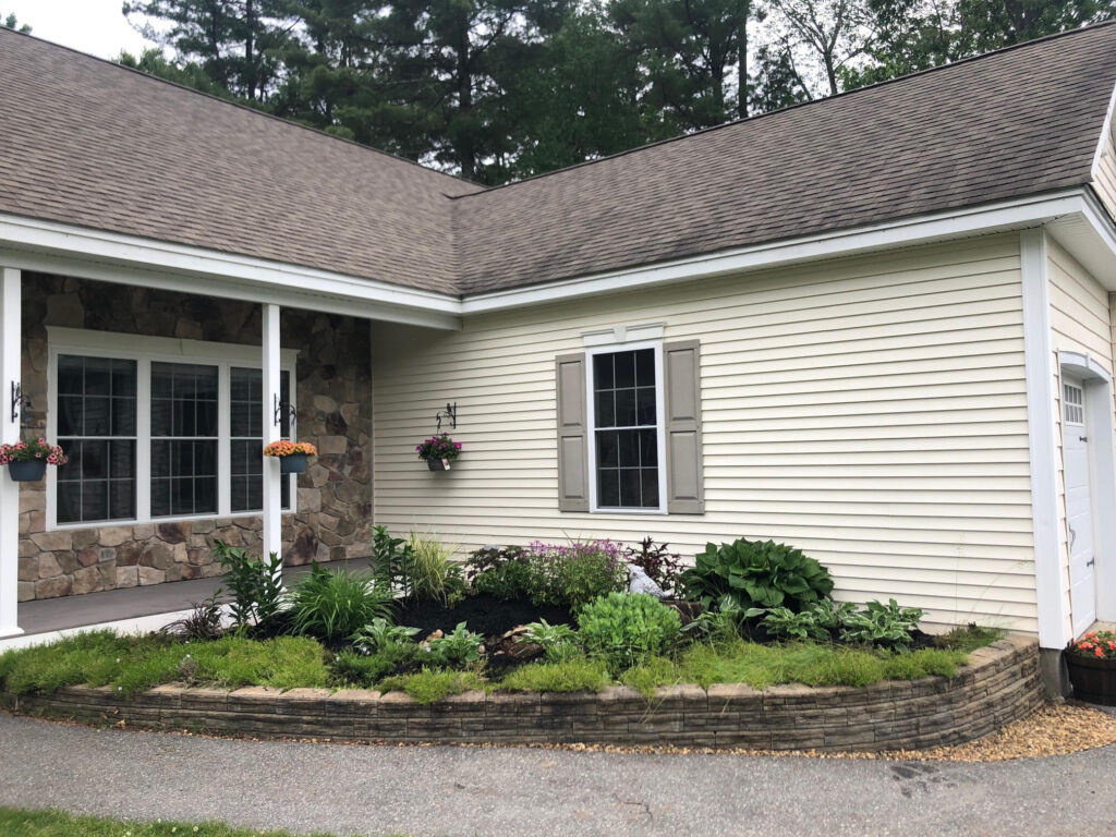 We added 53 perennials and 10 annuals for this low maintenance setup in Pelham, NH