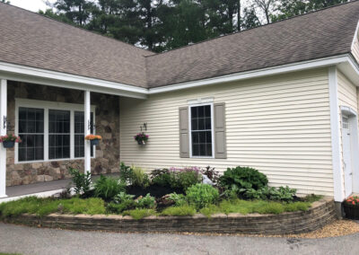 We added 53 perennials and 10 annuals for this low maintenance setup in Pelham, NH