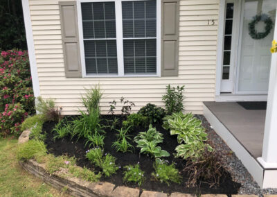 We added 53 perennials and 10 annuals for this low maintenance setup in Pelham, NH