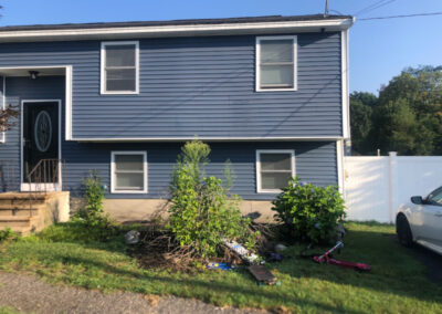 Greenleaf’s Garden Design weeded and then laid 4 yards of black mulch on this Nashua, NH property. There was a bit of pruning too. We also put in 13 mini petunias, and a red celosia.