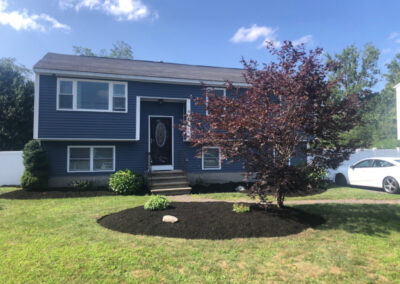 Greenleaf’s Garden Design weeded and then laid 4 yards of black mulch on this Nashua, NH property. There was a bit of pruning too. We also put in 13 mini petunias, and a red celosia.