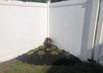 Greenleaf’s Garden Design weeded and then laid 4 yards of black mulch on this Nashua, NH property. There was a bit of pruning too. We also put in 13 mini petunias, and a red celosia.