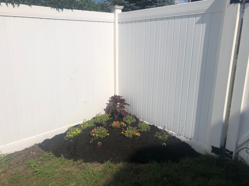 Greenleaf’s Garden Design weeded and then laid 4 yards of black mulch on this Nashua, NH property. There was a bit of pruning too. We also put in 13 mini petunias, and a red celosia.