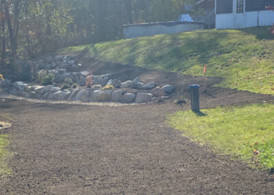 Fixing a rock wall in Dracut, MA