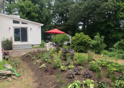 For this project, Greenleaf’s Garden Design transformed this cooked Nashua, NH lawn into a lovely garden. The project took 6 hours. We used 116 Perennials, 6 shrubs,16 yards of Garden Mix, and 6 yards of black mulch. Greenleaf’s Garden Design specializes in Garden Design, Maintenance, and Installation within 25 miles of Tyngsboro MA.