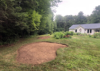 For this project in Amherst, NH, the crew from Greenleaf’s Garden Design used the low impact Dingo to pull out Juniper and Carolina Allspice from the property.