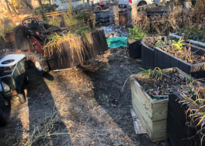 This Byfield, MA client had to move his plants from Brookline to Byfield. It took an hour to drive there. We unloaded the U-Haul truck with the Dingo Forks. It took an hour for the crew from Greenleaf’s Garden Design to move the 15 planter boxes/whiskey barrels.