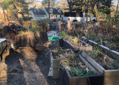 This Byfield, MA client had to move his plants from Brookline to Byfield. It took an hour to drive there. We unloaded the U-Haul truck with the Dingo Forks. It took an hour for the crew from Greenleaf’s Garden Design to move the 15 planter boxes/whiskey barrels.