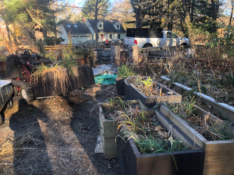 This Byfield, MA client had to move his plants from Brookline to Byfield. It took an hour to drive there. We unloaded the U-Haul truck with the Dingo Forks. It took an hour for the crew from Greenleaf’s Garden Design to move the 15 planter boxes/whiskey barrels.