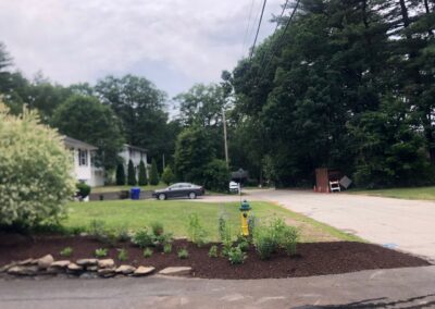 This fun project in Hudson, NH had the crew revisiting and revamping one of our existing gardens! The Excavator dug out 10 yards of poor soil and replaced it with 10 yards of good soil. Last year , in early July, we planted 100 perennials of which half were shade and the others sun loving. These new 80 perennials really made the front side and back yard pond garden quite lovely.