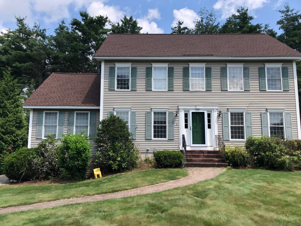Greenleaf’s Garden Design pulled bittersweet vines off the bushes and then laid 4 yards of dark brown mulch to this Bedford NH property.