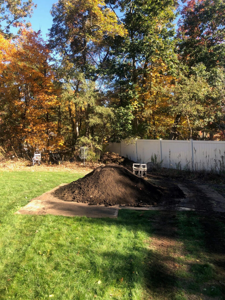 On Day 3, the crew and Dingo got to work. The dingo moved 10 yards of compost mixed with 4 yards of Soil.