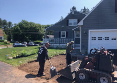 We were called in to see if this old garden in Billerica, MA with bittersweet could be saved. I said the best bet is to dig everything up and go down 8” deep. The Dingo made short work of removing the 7 yards of soil and then replacing it. The new 30 summer focused flowering perennials made the bunnies mad because the fence will keep them out!! This garden took 6 hours to complete.