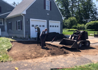 We were called in to see if this old garden in Billerica, MA with bittersweet could be saved. I said the best bet is to dig everything up and go down 8” deep. The Dingo made short work of removing the 7 yards of soil and then replacing it. The new 30 summer focused flowering perennials made the bunnies mad because the fence will keep them out!! This garden took 6 hours to complete.
