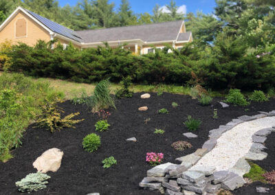 At our 6-year-old North Conway, NH gardens we added 15 annuals, 30 perennials, and 4 yards of black mulch. It took 2 gentlemen 8 hours to complete the renovations.