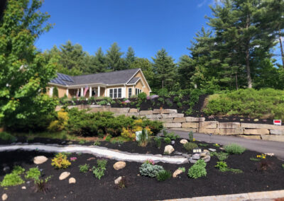 At our 6-year-old North Conway, NH gardens we added 15 annuals, 30 perennials, and 4 yards of black mulch. It took 2 gentlemen 8 hours to complete the renovations.