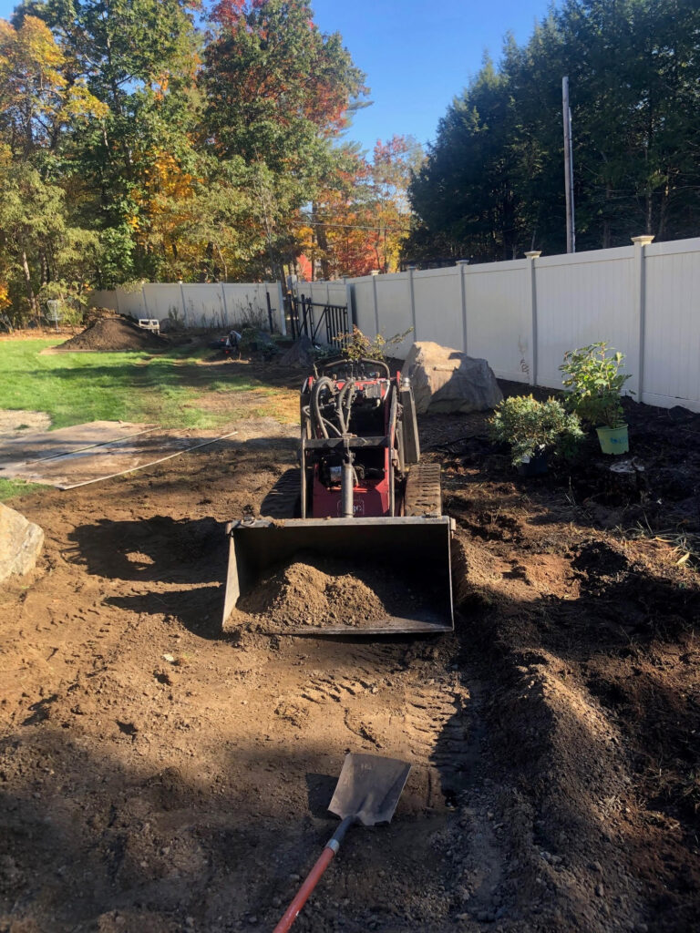 On Day 3, the crew and Dingo got to work. The dingo moved 10 yards of compost mixed with 4 yards of Soil.